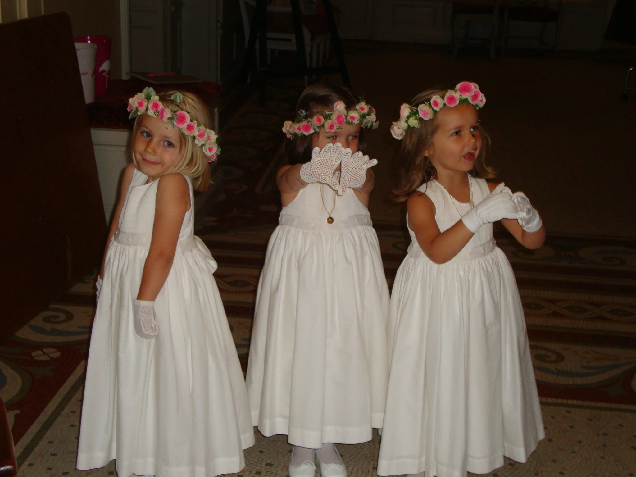 Beautiful flower girls in their white handmade smocked dress for a very chic French wedding