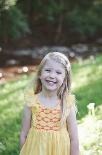 Savannah: a ray of sunshine in her Netti smocked dress