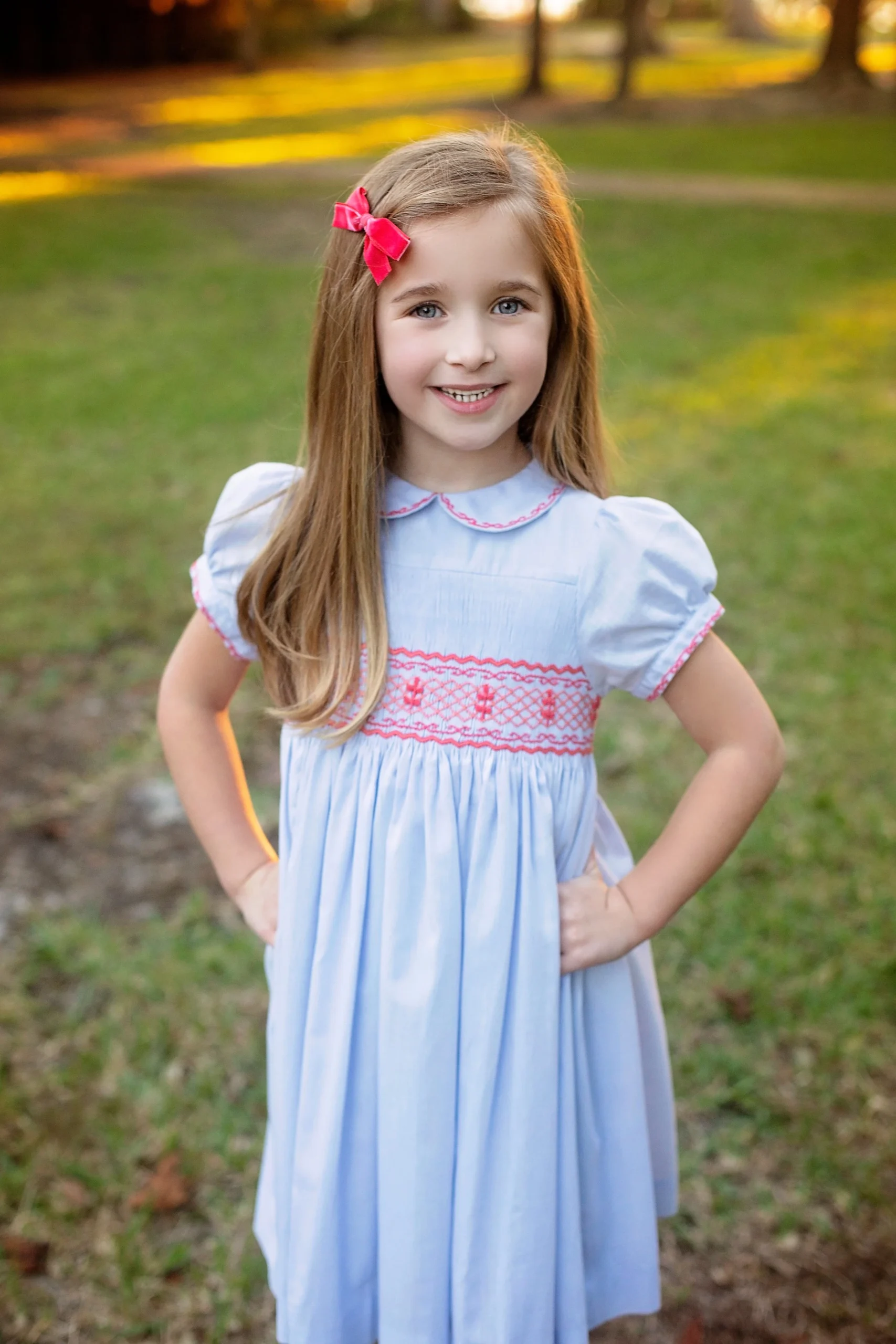 Christmas card Frazier in her handmade Princess Charlotte smocked dress