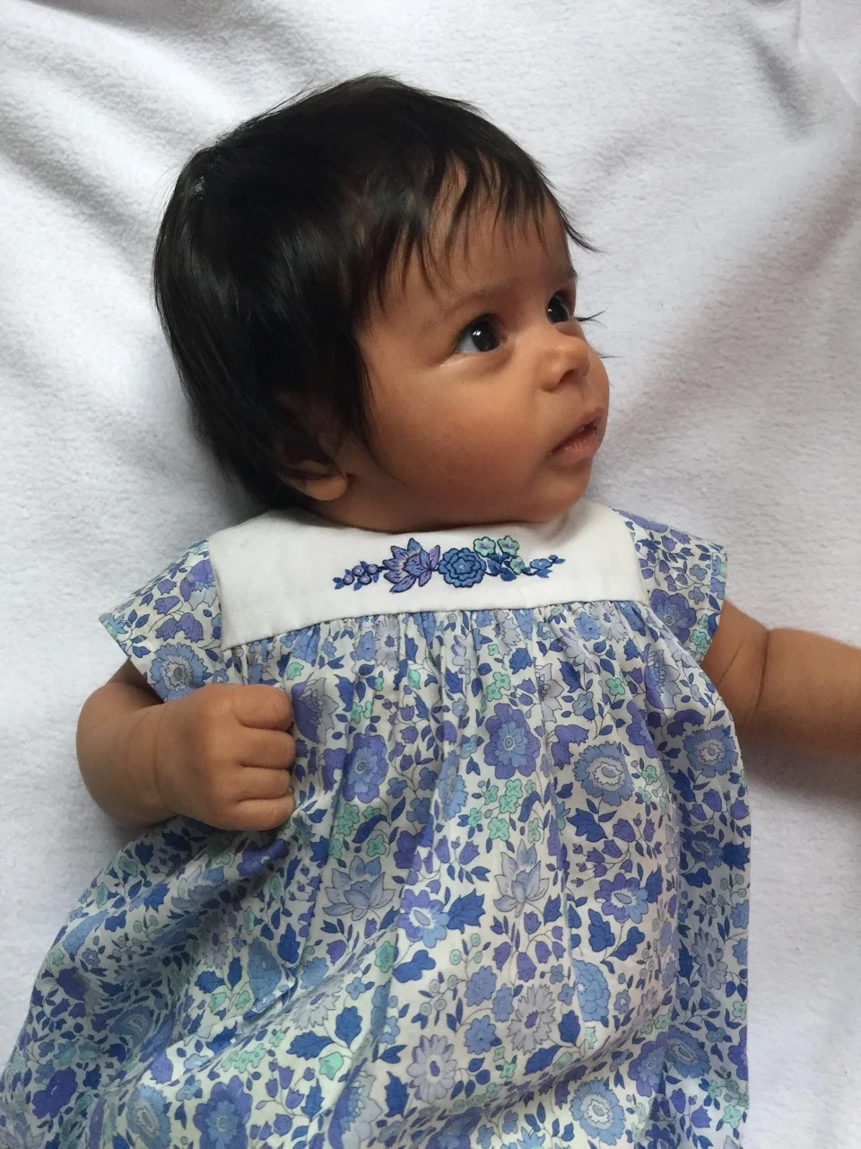 Nina in her handmade Liberty dress with delicate embroideries