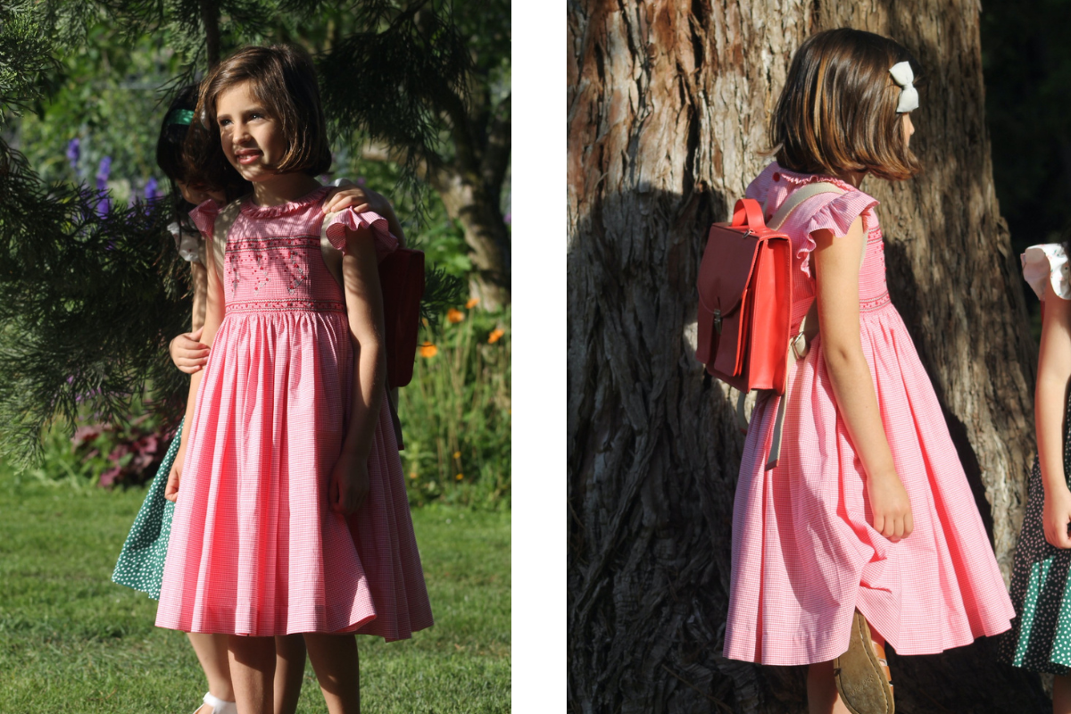 Classic children's dress styled with traditional leather school satchel, French school traditions, timeless children's fashion, rentrée style